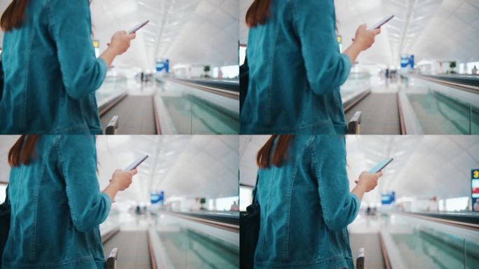 在机场，一名女子拿着登机牌走到登机口，查看智能手机