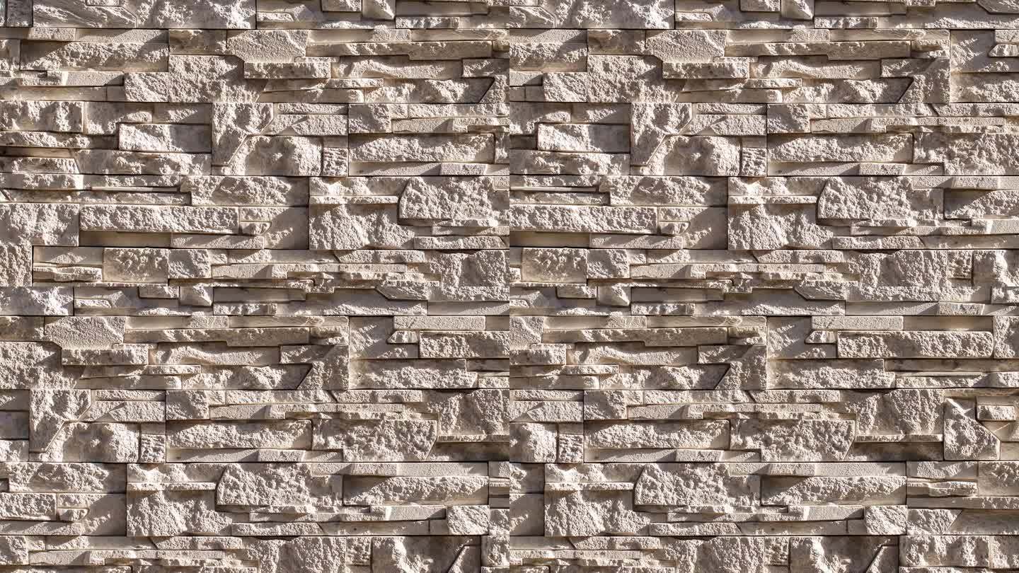 墙内，石砌的米色平石劈得参差不齐，侧身移动，特写宏观，俯视图