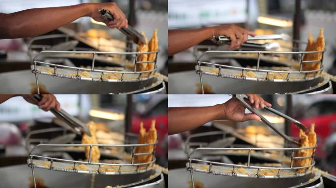 街边小贩在做印尼脆皮香蕉油饼。街头食品。当地食物。Makang pisang goreng。