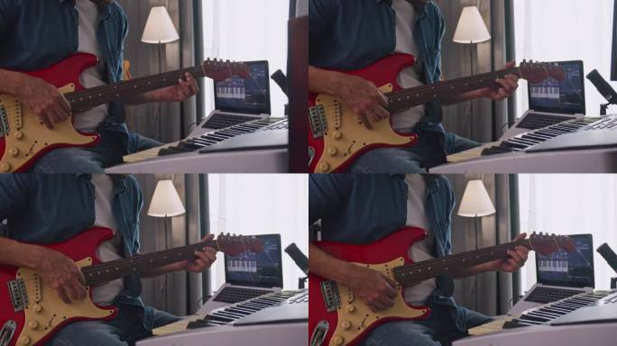 一个音乐家在家里的数码录音室录制电吉他。作曲家正在使用现代设备来创作旋律。