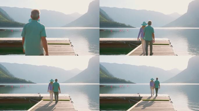 一对老年夫妇沿着木制湖码头散步