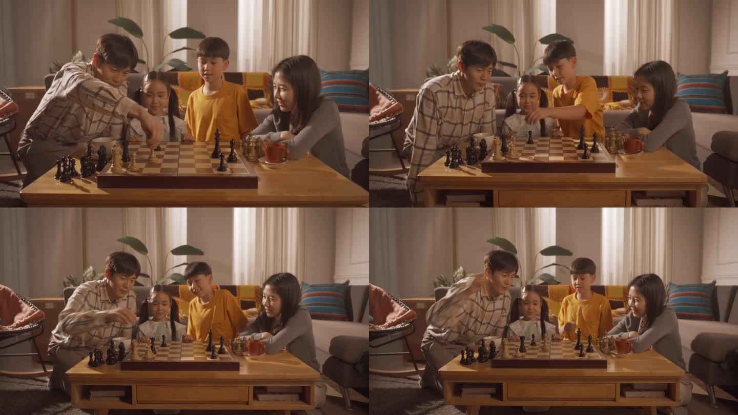 幸福的韩国家庭周末晚上在家里一起度过:父亲和儿子在母亲和女儿的注视下下棋。父母和孩子共度美好时光