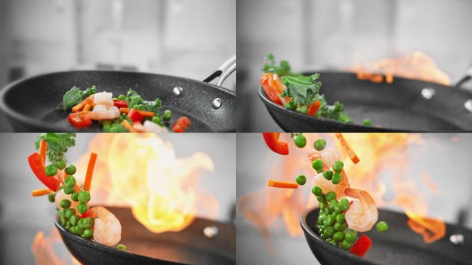 在慢动作的火焰上炒菜时，用煎锅炒虾和蔬菜