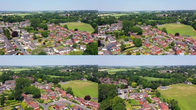 这是英国西约克郡韦克菲尔德市美丽的海姆斯沃斯小镇的航拍画面，展示了一个炎热的夏日里小镇周围的住宅区