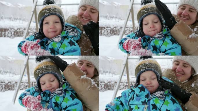 年轻有爱心的母亲在公园玩耍后，为儿子抖掉身上的雪。寒假里的欢乐，孩子们在户外玩耍，在雪中活动