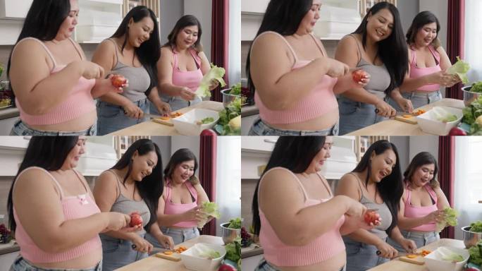 快乐骄傲的女人正确的权力加上尺寸。三个超重妇女在厨房里吃健康的食物。