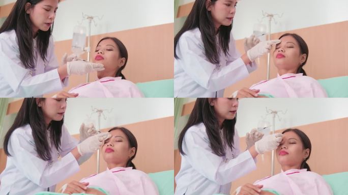 在美容诊所，医生给病人注射肉毒杆菌素。