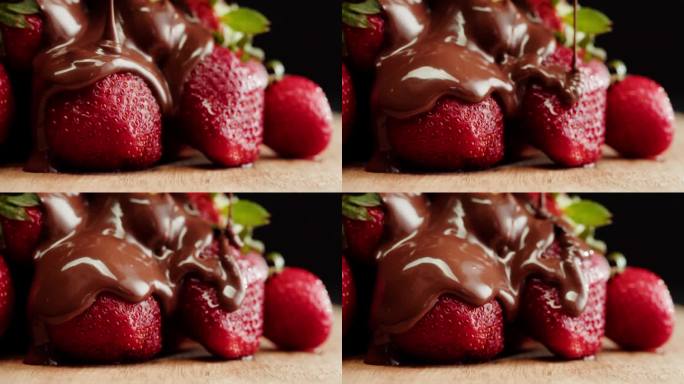 融化巧克力中的草莓特写，融化巧克力棒做火锅。浆果配巧克力慕斯。专业厨师烹饪蛋糕甜点。