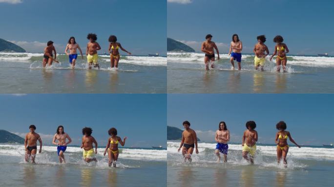 一群朋友在海滩上以慢动作从海里跑出来，玩得很开心