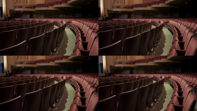 空旷的剧院，舒适的红椅子，黑暗剧院的电影院座位