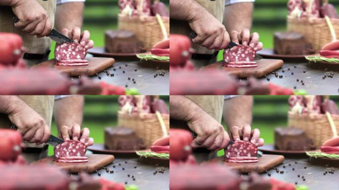 男农民厨师手剁自制肉肥肠用刀在木板上户外特写