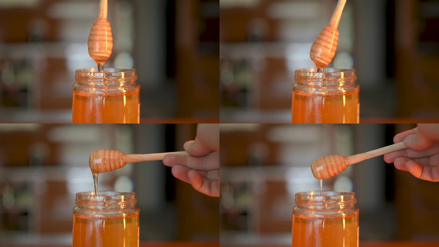 蜂蜜滴，从特殊的蜂蜜勺倒在玻璃碗里