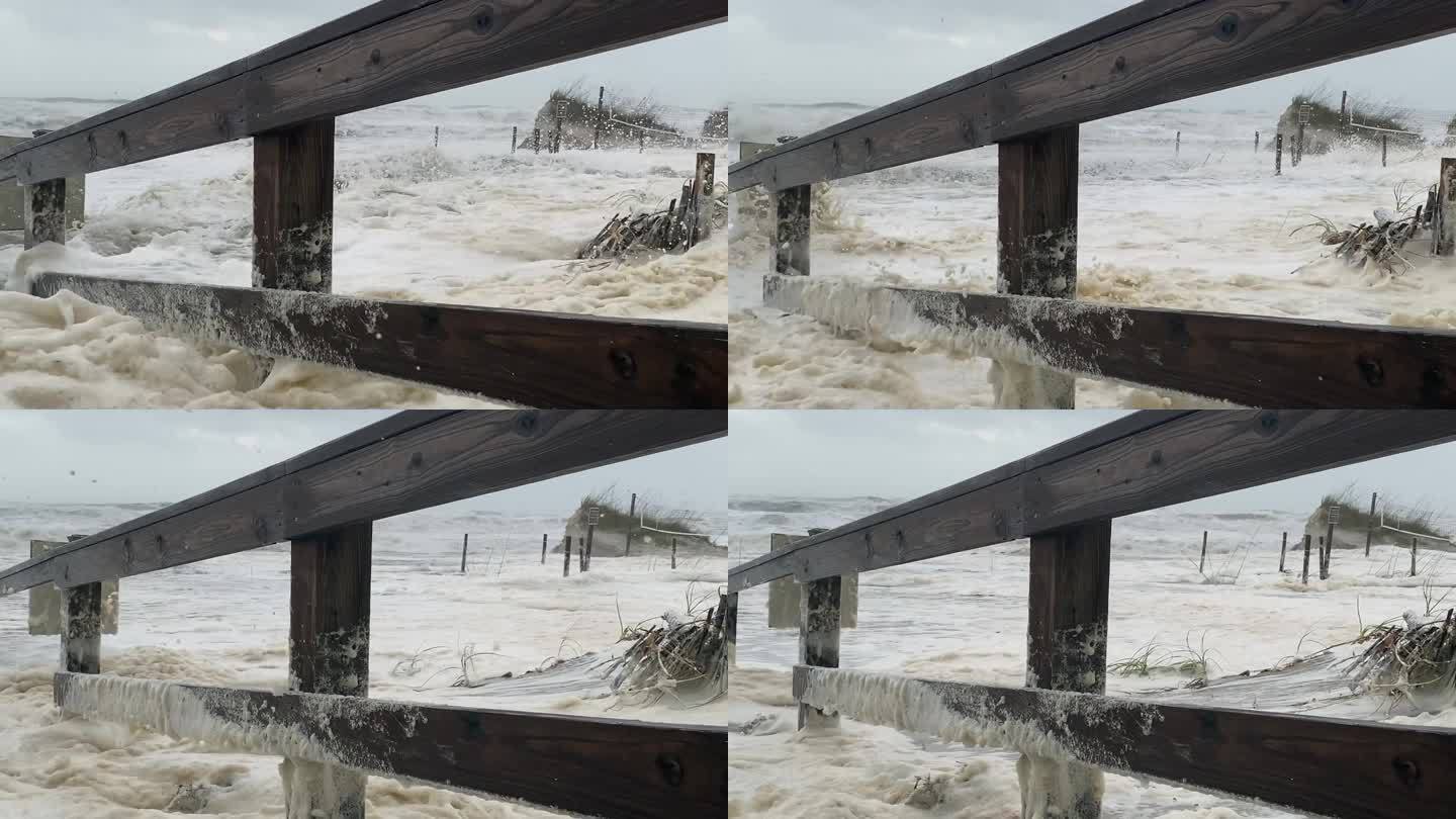 佛罗里达的飓风浪潮和风暴潮淹没了沙滩沙丘、人行道并摧毁了围栏