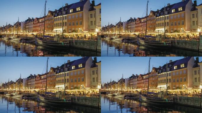 丹麦哥本哈根。在哥本哈根，用4K HDR拍摄的尼哈芬运河(新港)的彩色房屋和帆船