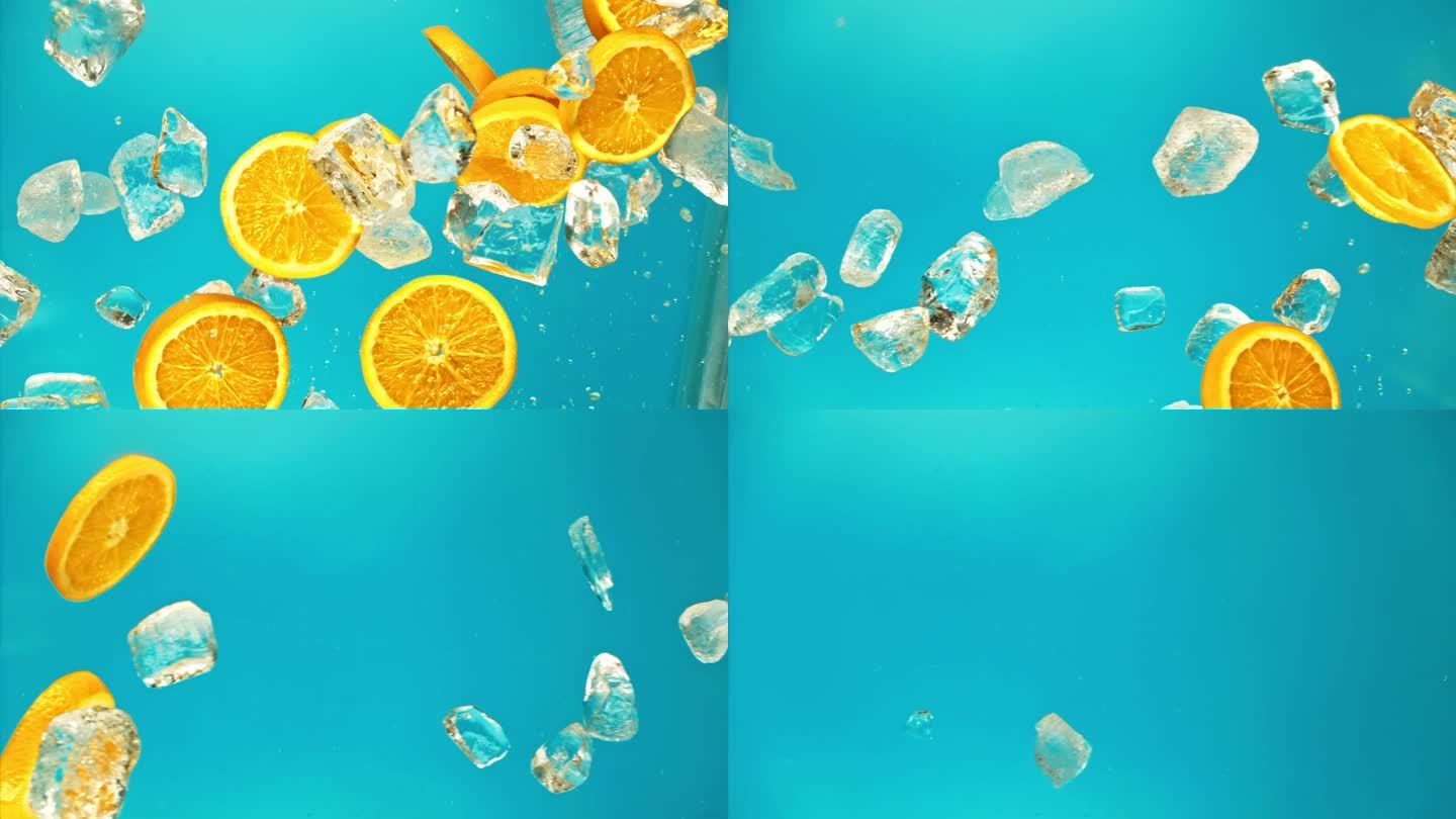 新鲜多汁的橙子和果汁，冰块和水滴飞溅倒在超级慢动作1000 fps。柑橘橙片和冰块飞或落在蓝色背景，