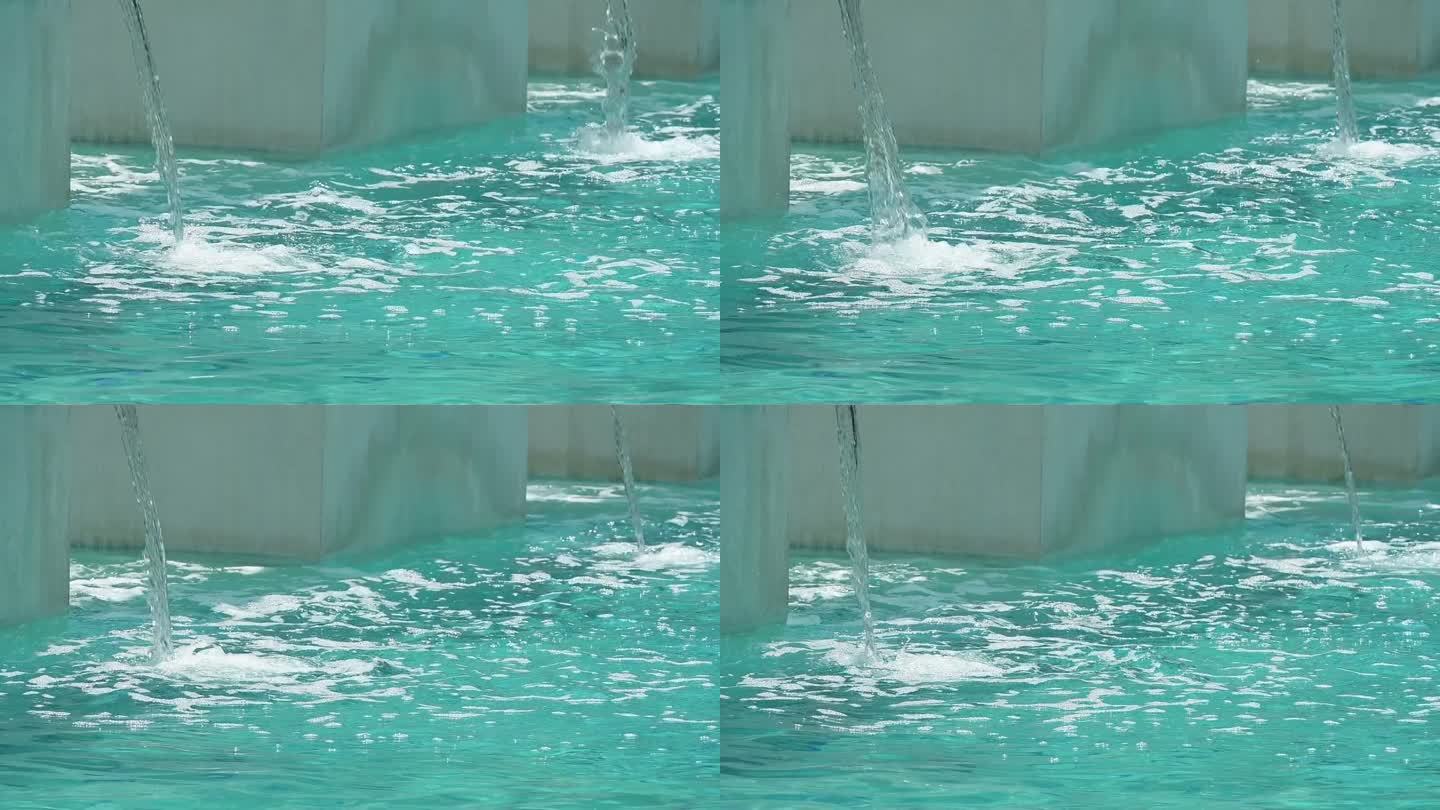 在游泳池中进行水力按摩的瀑布，慢动作场景