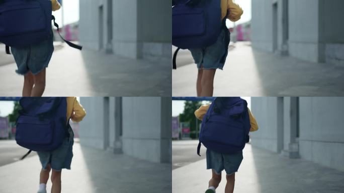 一个小女孩高兴地背着书包，去上学。