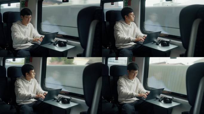 一个亚洲商人坐在火车上，然后把注意力集中在笔记本电脑上，开始工作。