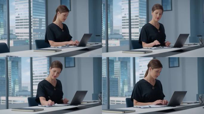 成功的白人女商人在大城市角落办公室用笔记本电脑工作的肖像。职业女性数字企业家为在线业务做数据分析。
