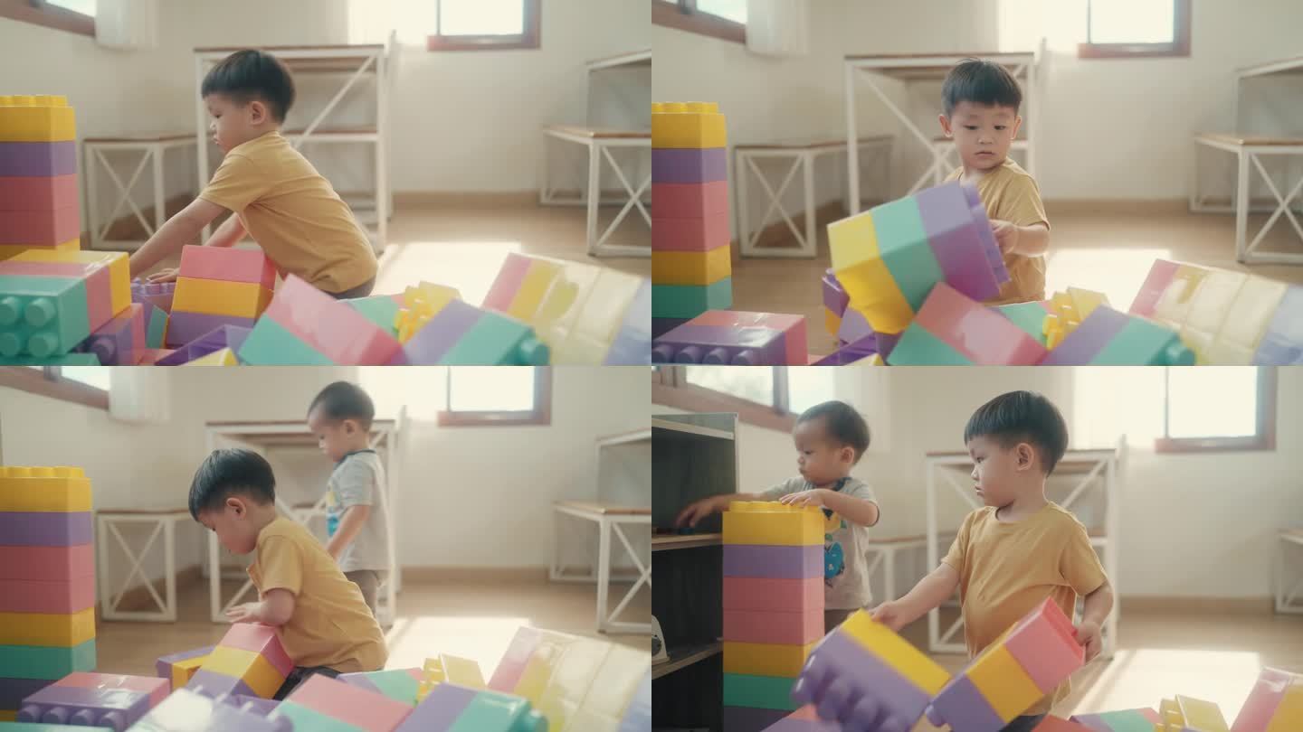 童年的快乐:亚洲幼儿在室内玩积木时拥抱想象力和乐趣。