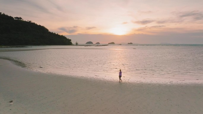 Lonely Woman  walking at the beach