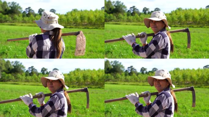 农妇肩上扛着锄头挖土的特写镜头