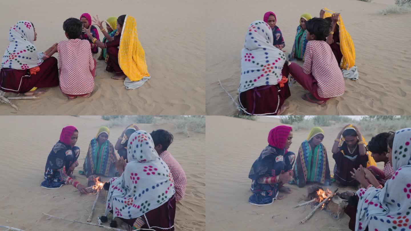 印第安孩子在沙丘上搭起篝火