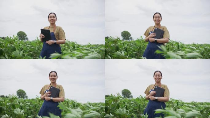 一个在农场干活的女人双臂交叉地站着