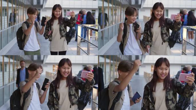 多民族青少年用智能手机看搞笑视频，在户外跳舞