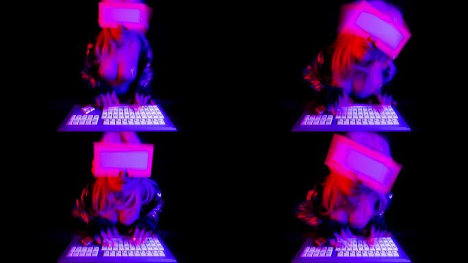 女人在电脑上发光色彩视觉创意虚影