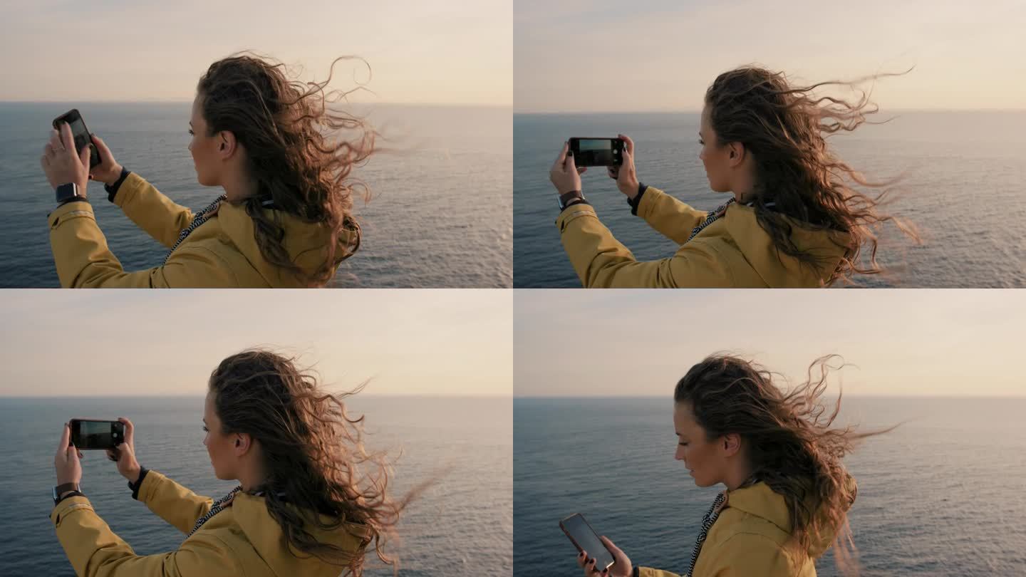 女子用智能手机拍摄日落，女孩用柔和的光线拍摄日出海景，享受假期旅行冒险