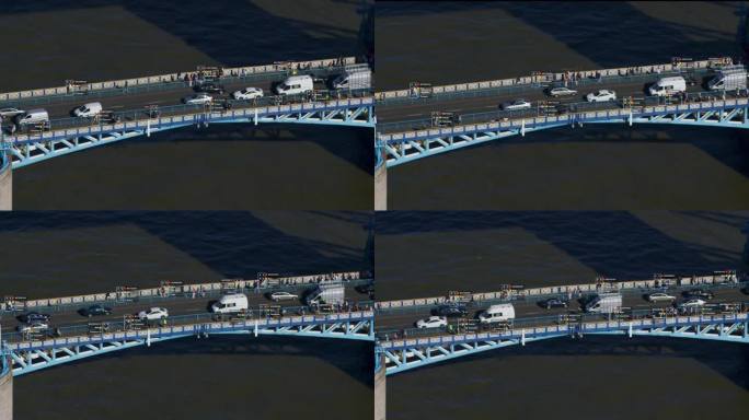 监测的概念。伦敦塔桥上通勤者的鸟瞰图。面部识别界面显示性别，身份证，种族和服装类型。人工智能。英格兰
