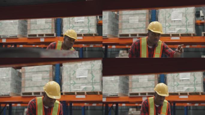 非洲工人在查看仓库时检查物品