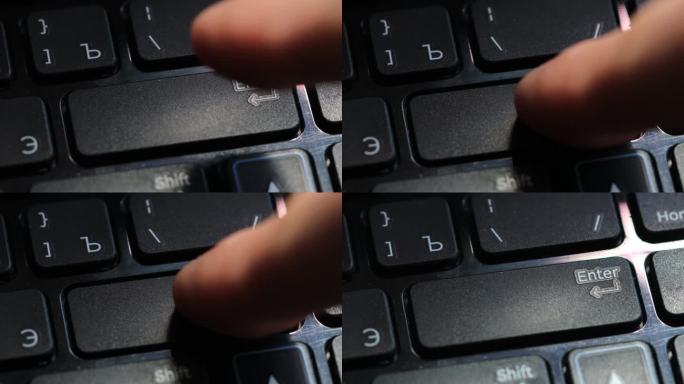 手指按下笔记本电脑键盘上的回车键