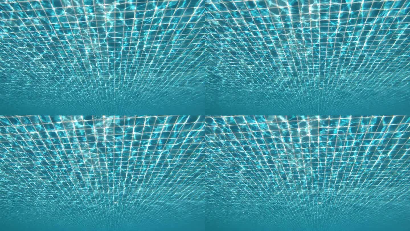 潜入水中的蓝色游泳池，美丽的泳池纹理背景，慢动作场景