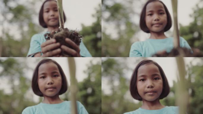 小女孩手里拿着小植物。拯救世界和生态理念。