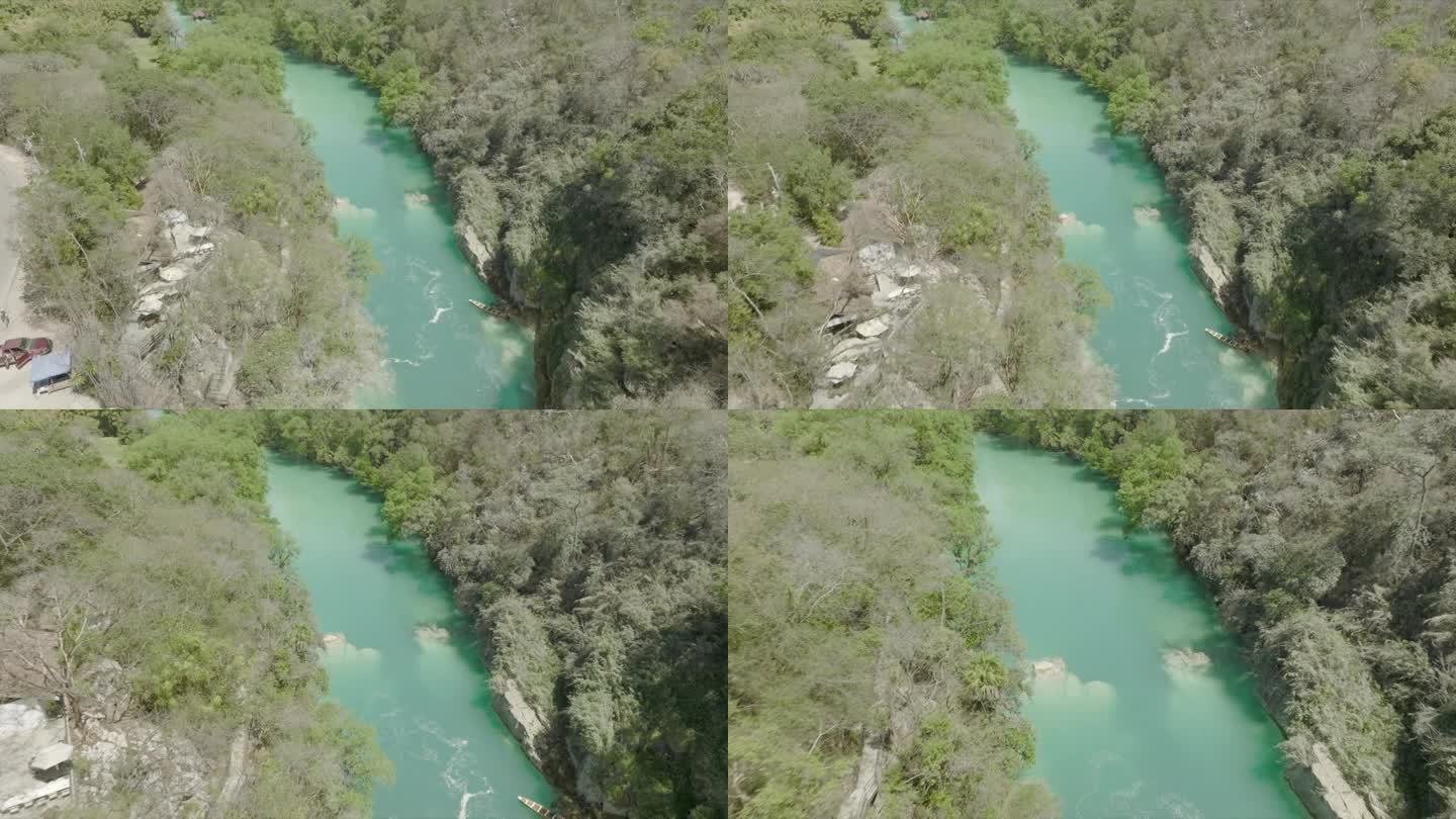 空中无人机俯瞰悬崖和河流上的瀑布