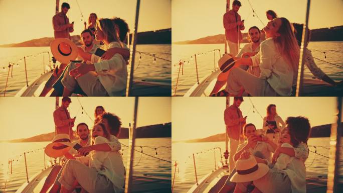 两个女人在船上聚会上玩得很开心。男性朋友正在用手机拍照