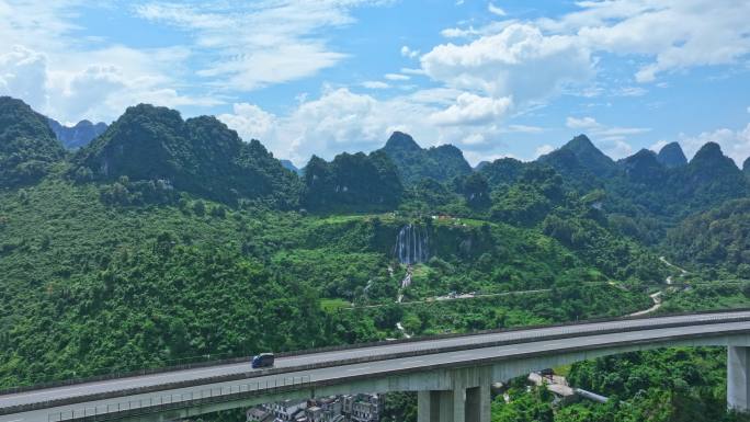 航拍广西百色靖西三叠岭瀑布古龙山大桥