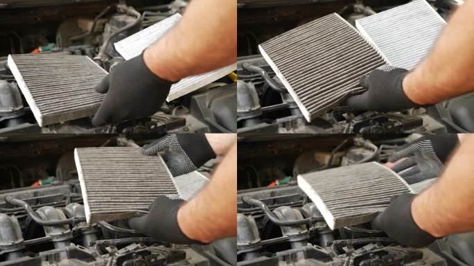 用新的空气过滤器替换旧的堵塞的空气过滤器。汽车修理和保养。