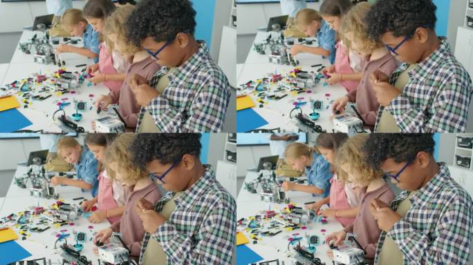 不同的孩子在科学夏令营制作机器人模型