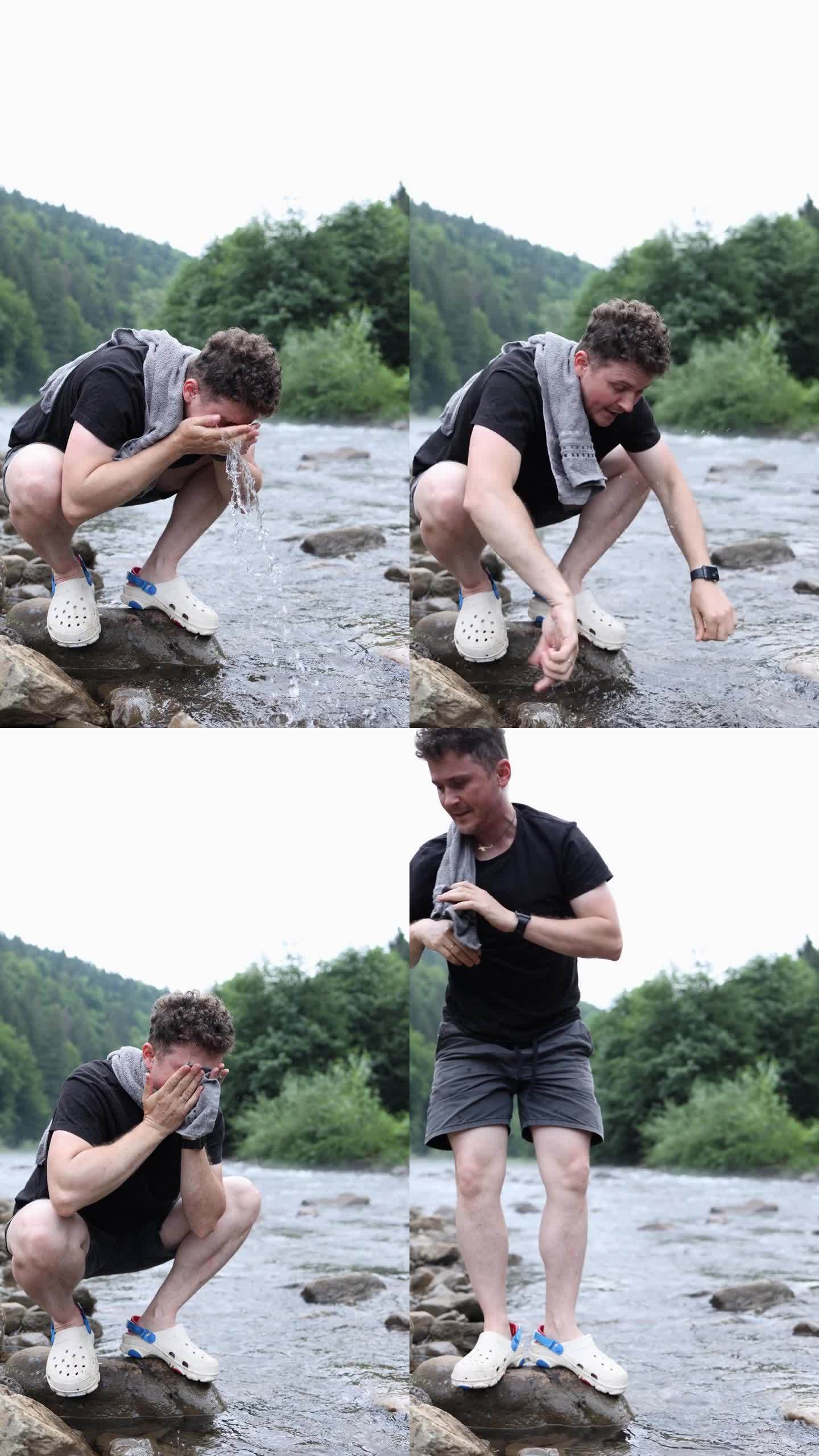 一个穿着黑色t恤和短裤的人在山间的河里洗脸。垂直视频