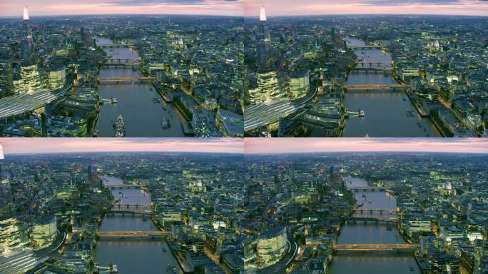 伦敦著名地标鸟瞰图。经过泰晤士河上伦敦著名桥梁的车辆。几艘船在河上航行，桥上挤满了人。英格兰。英国。