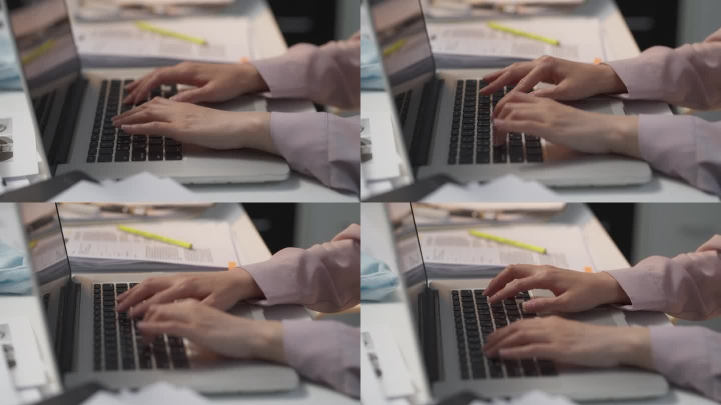 项目经理的手专注于笔记本电脑键盘的特写镜头。管理，组织和处理关键文件和远程工作流程的通信