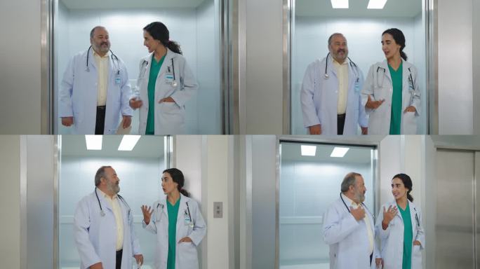 资深男医生和穿制服的女助理在医院走廊边走边交谈和讨论。队友，友善的医生和同事