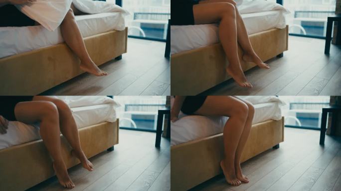 女人下床的特写，漂亮的女人腿，没有脂肪团