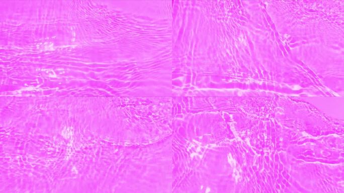 紫色的水面上泛起涟漪。散焦模糊透明粉红色透明平静水面纹理与飞溅和泡沫。水波与闪亮的图案纹理背景。