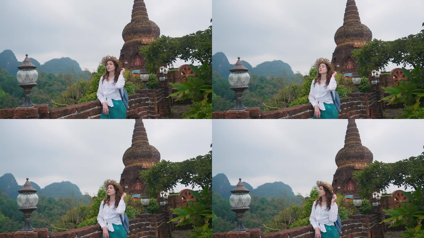 一名女子在泰国的寺庙里看丛林