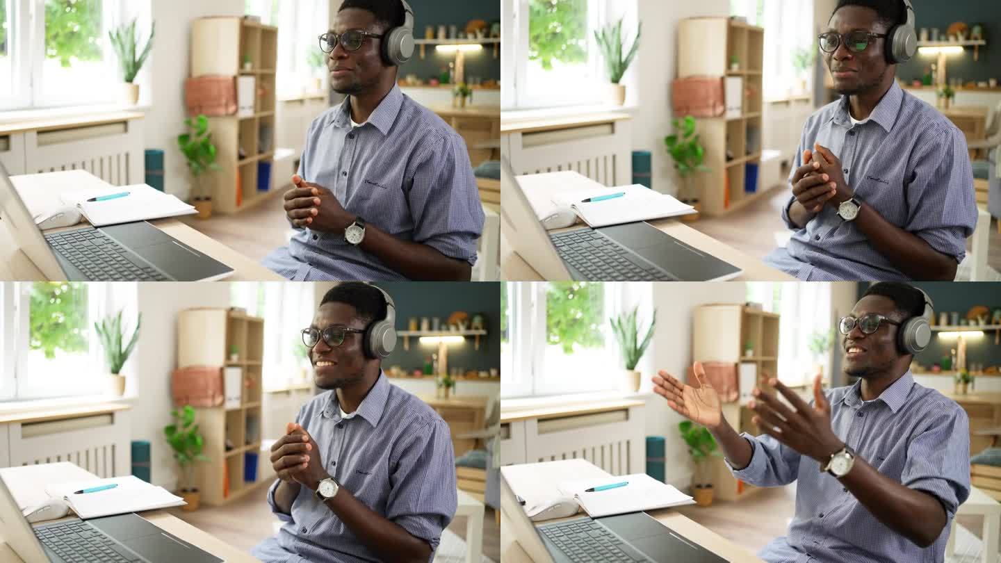 一个非洲裔美国人在他现代化的家里参加网上工作面试
