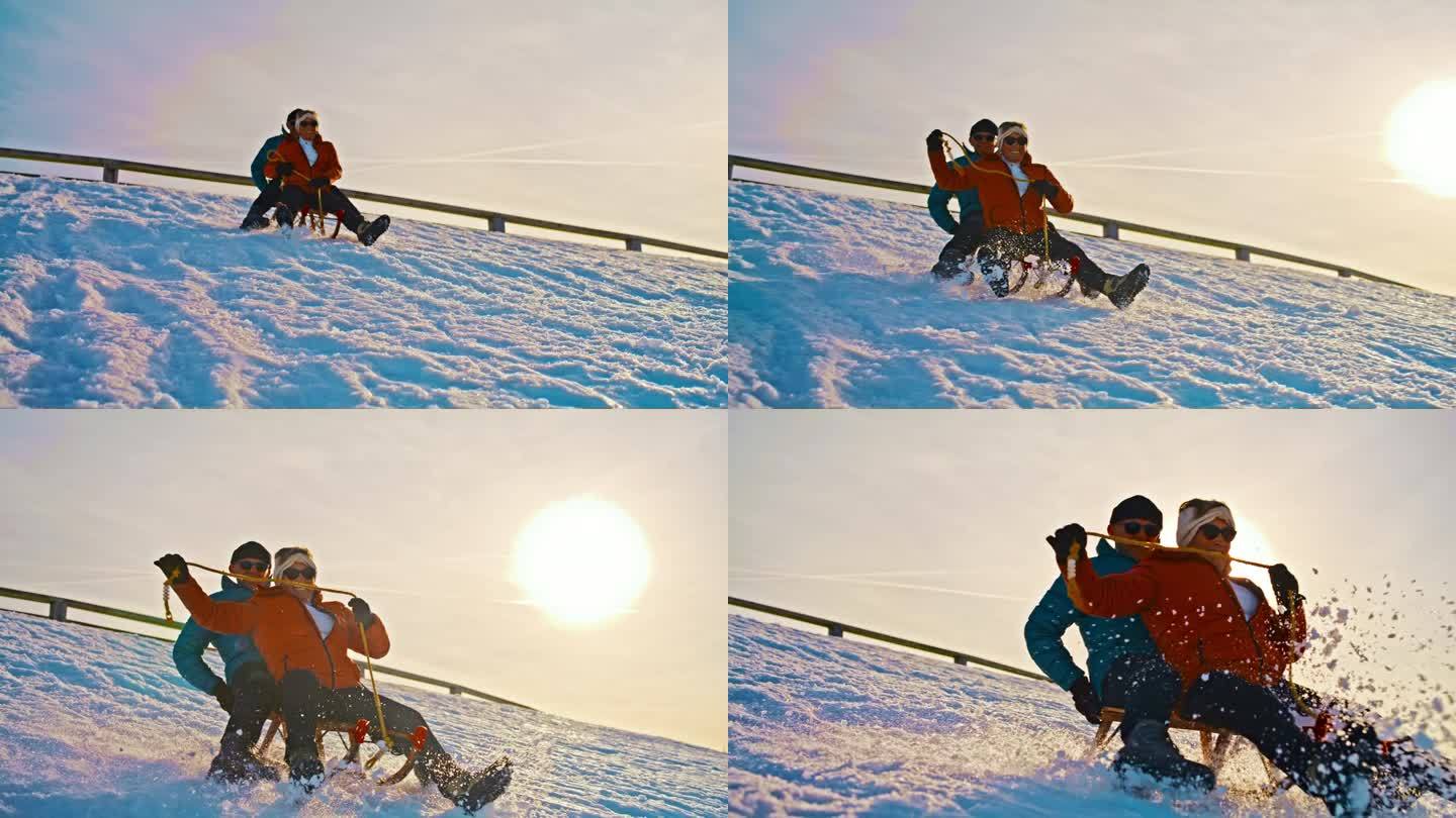 一对老年夫妇在日落时从雪坡上滑下，玩得很开心